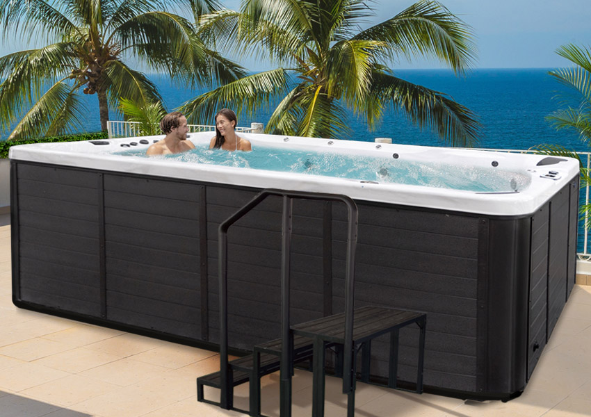 Hot Tubs, Spas, Portable Spas, Swim Spas for Sale Hot Tubs, Spas, Portable Spas, Swim Spas for Sale Calspas hot tub being used in a family setting